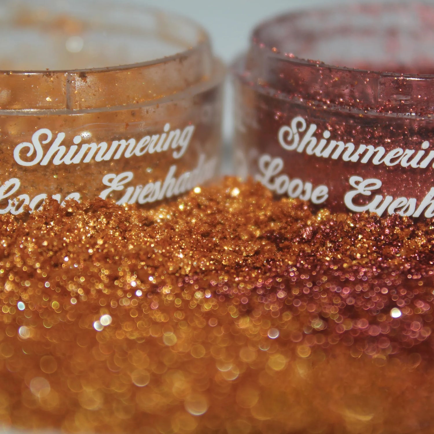 2 Shimmering Loose Eyeshadow powders on table