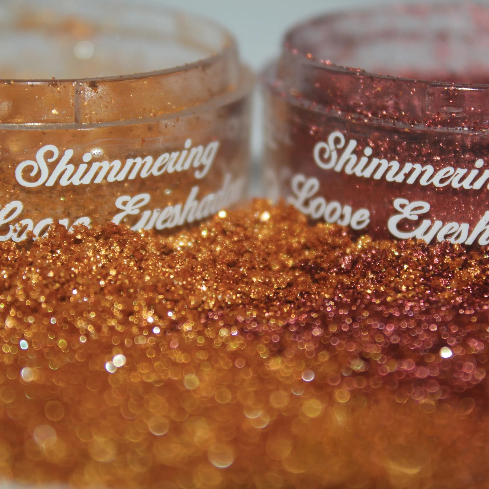 2 Shimmering Loose Eyeshadow powders on table