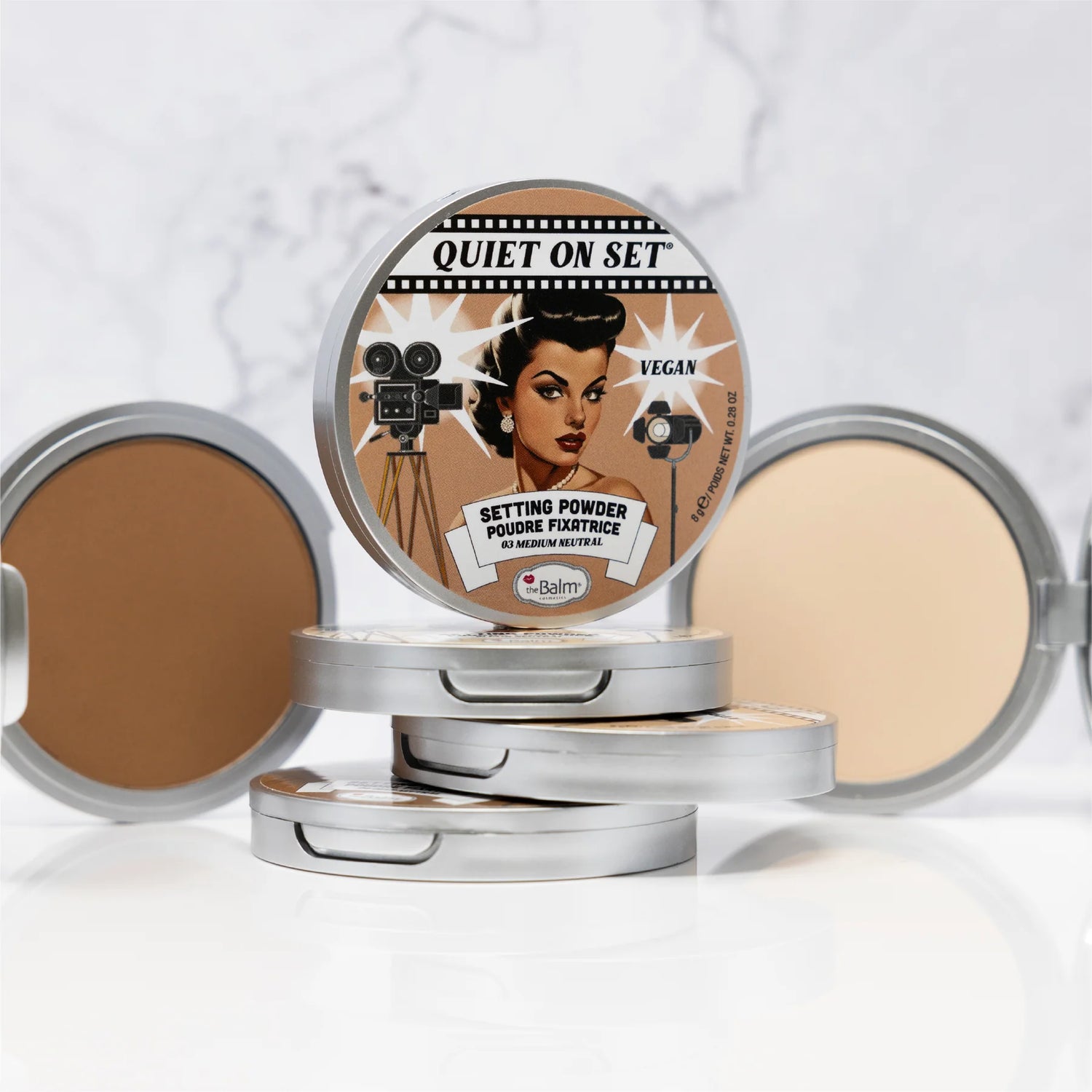 stacked setting powders with marble background